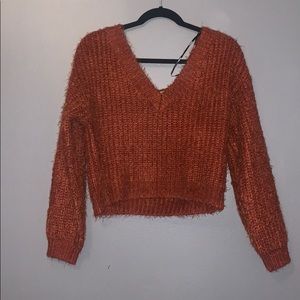 cropped V neck reddish sweater
